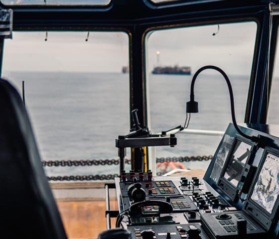 Ship control board next to ocean