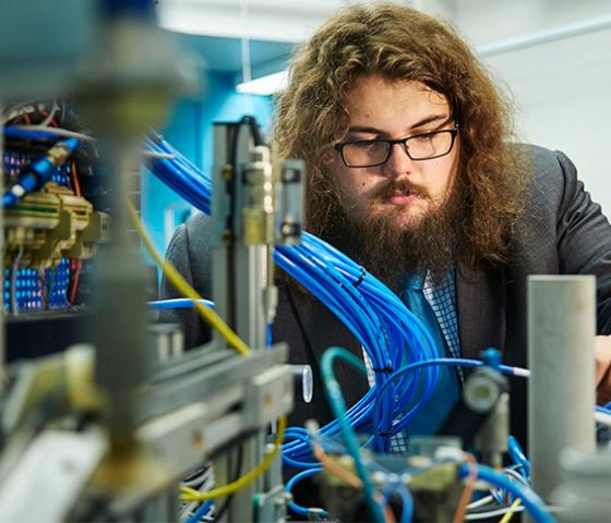 person working with electrical engineering equipment