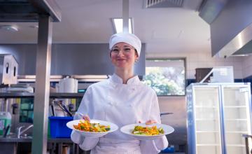 Alexis holding two plates