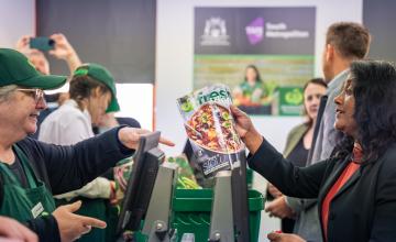 Students serving MD at Woolworths register
